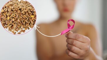 Graine de lin avec une femme tenant un ruban rose contre le cancer du sein.